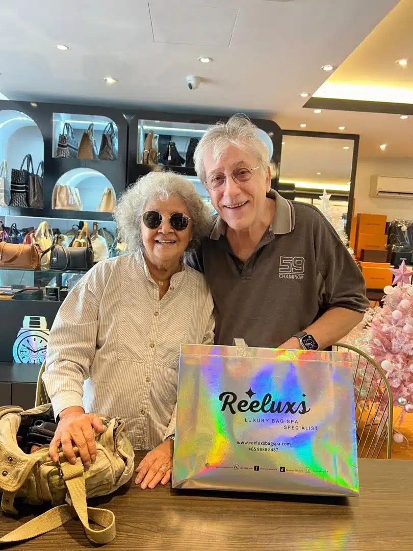 A Reeluxs customer collecting her bag at the outlet